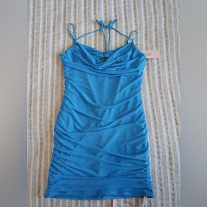 Oh Polly mini dress with adjustable straps and a halter tie detail🩵